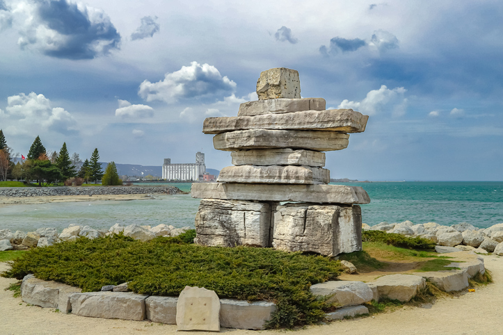 inukshuk standing against a dramatic sky on Georgian Bay